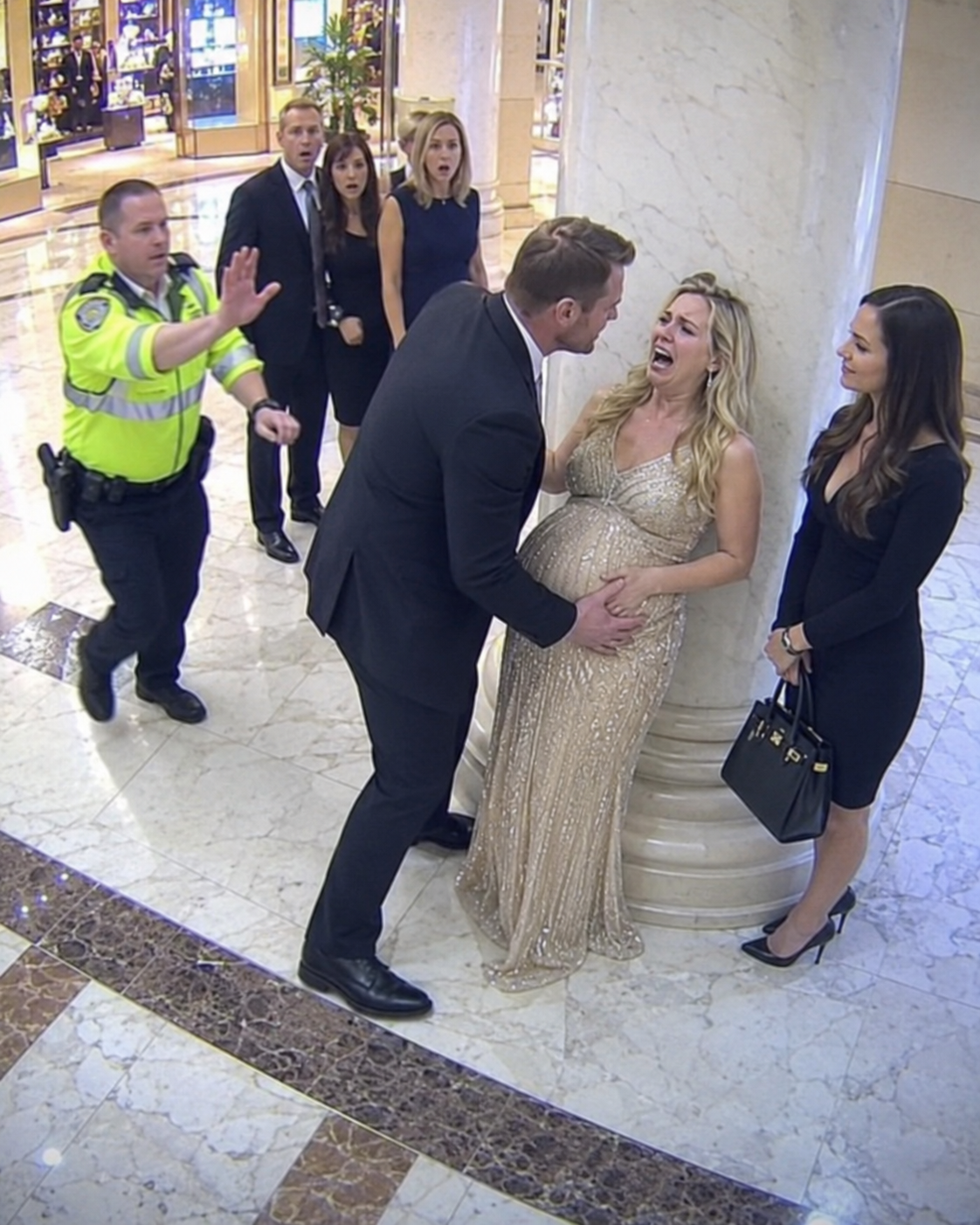 My millionaire husband slapped me in the middle of the mall while his mistress laughed beside him. I held my eight-month belly and whispered, “Please… not in front of our baby.” He leaned close and hissed, “You’re nothing without me.” But then the crowd went silent. My father stepped from the elevator, surrounded by lawyers, and said, “Touch my daughter again, and your empire dies tonight.”