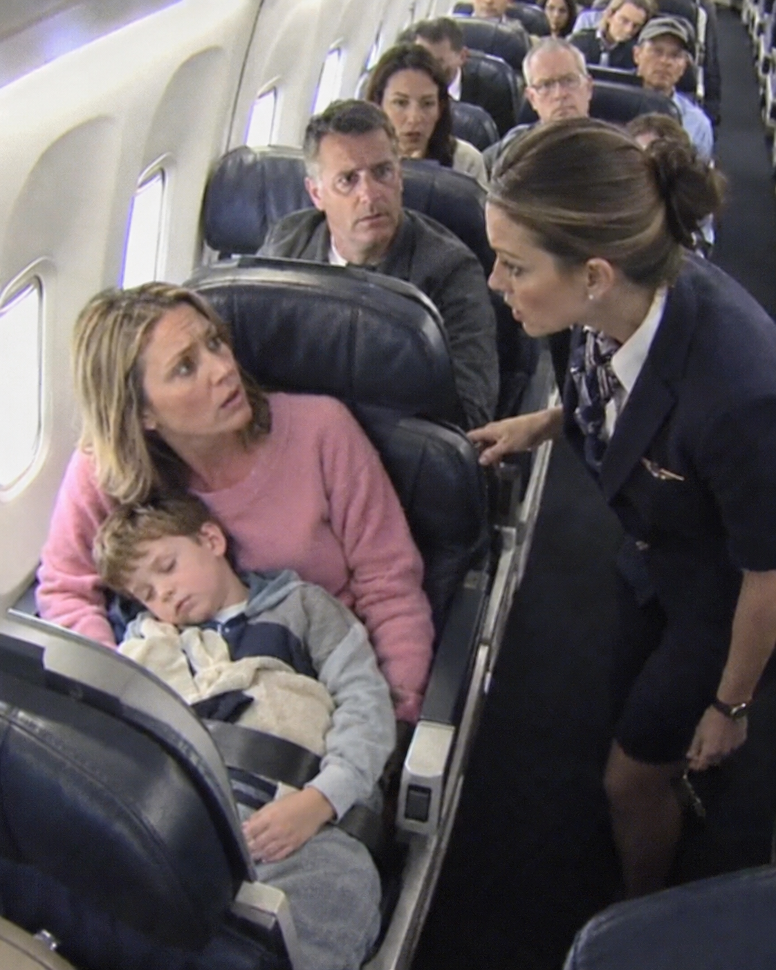 A Single Mom Was Napping in Seat 8A—Until the Captain’s Voice Came Over the Intercom: “Is There a Fighter Pilot on This Plane?”